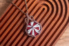 Red, Black, and White Swirled Fused Glass Pendant with Copper Wire Wrapping