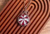 Red, Black, and White Swirled Fused Glass Pendant with Copper Wire Wrapping