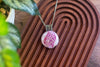 Crisscross Sterling Silver Pendant with Swirling Pink Fused Glass Cabochon