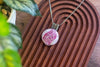 Crisscross Sterling Silver Pendant with Swirling Pink Fused Glass Cabochon