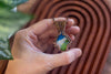 Blue, White, and Green Fused Glass and Copper Wire Teardrop Pendant