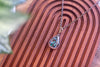 Green, Blue, and Black Fused Glass and Copper Wire Teardrop Pendant