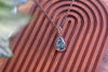 Green, Blue, and Black Fused Glass and Copper Wire Teardrop Pendant