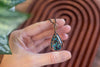 Green, Blue, and Black Fused Glass and Copper Wire Teardrop Pendant